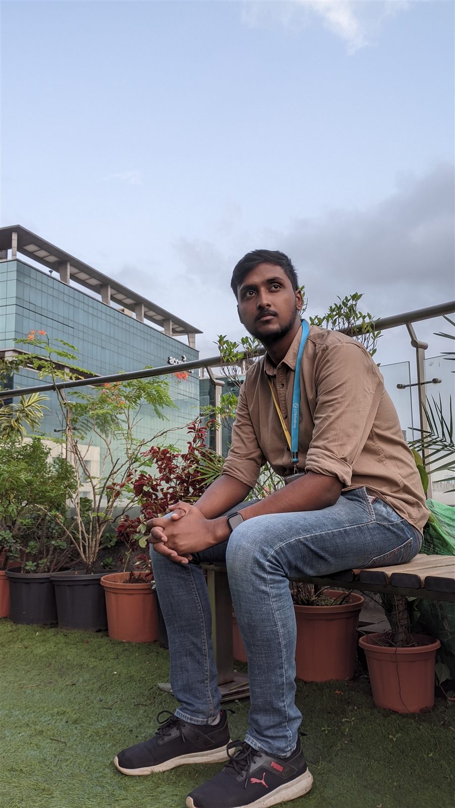 Vishwas Jha on an office rooftop garden at dusk